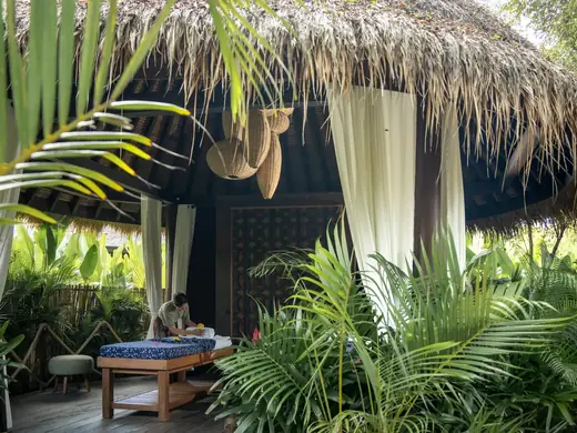 Kuara spa pavilion among tropical greenery