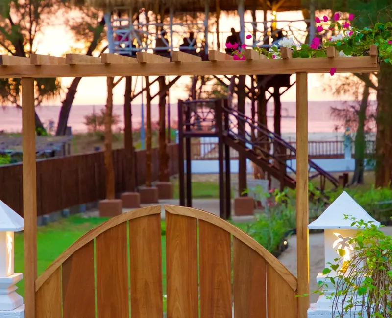 Wooden gate and sunset pavilion at Sunset Beach Yoga