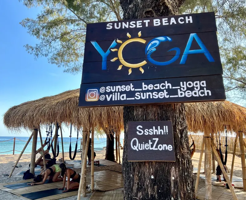Sunset Beach Yoga sign on the beach